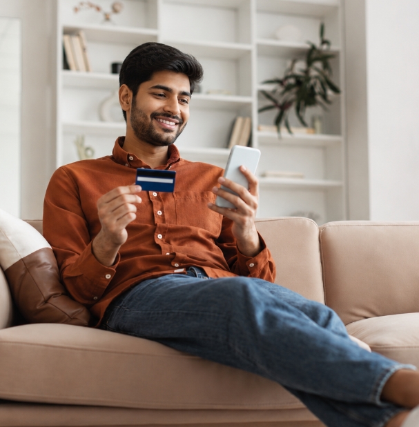 Customer using a smartphone and bank card for digital banking