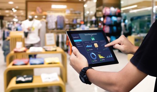 Retail employee using a tablet to access RFID-enabled operational data